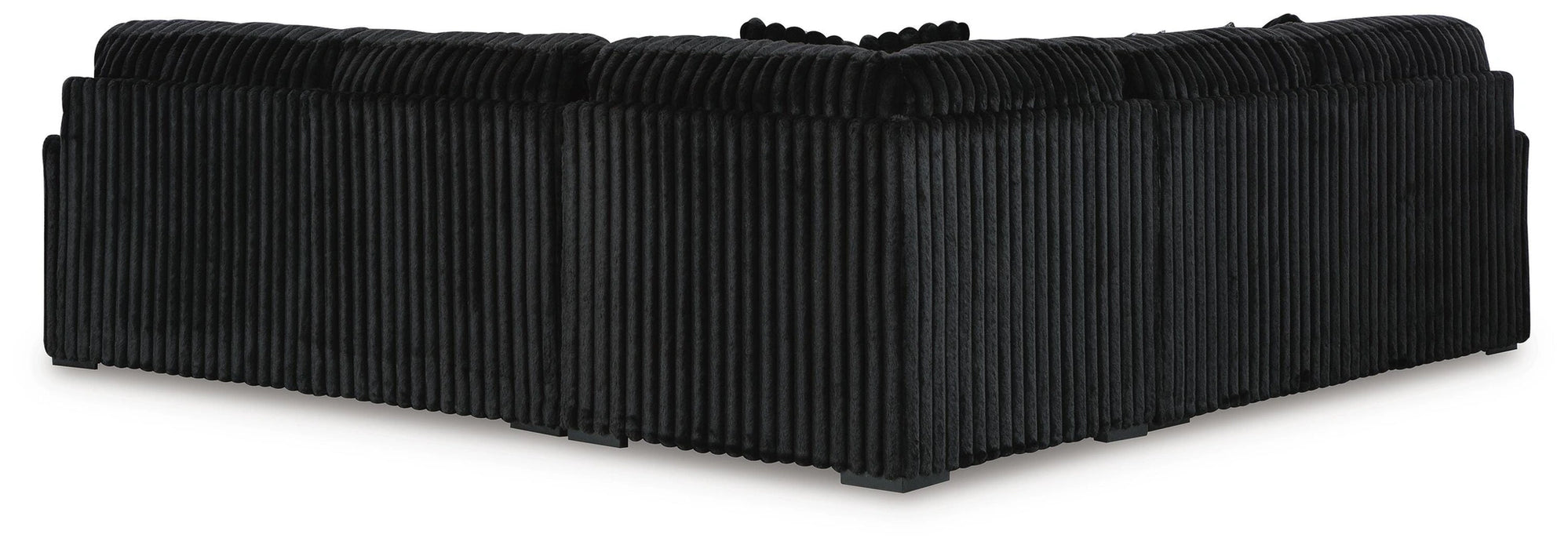 Black L-shaped sectional sofa with a distinctive vertical ribbed fabric texture, viewed from the back and side.