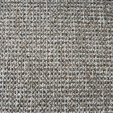 A close-up of a woven fabric swatch with a textured, multi-tonal appearance, featuring threads of light gray, white, and dark brown.