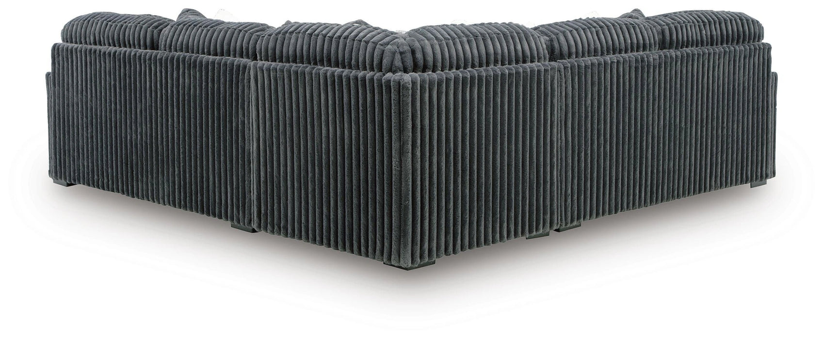Dark gray L-shaped sectional sofa upholstered in a wide-ribbed corduroy-like fabric, viewed from the back and side, featuring plush back cushions.