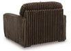 Brown ribbed fabric armchair, viewed from the back and side, featuring a plush texture and dark square feet.