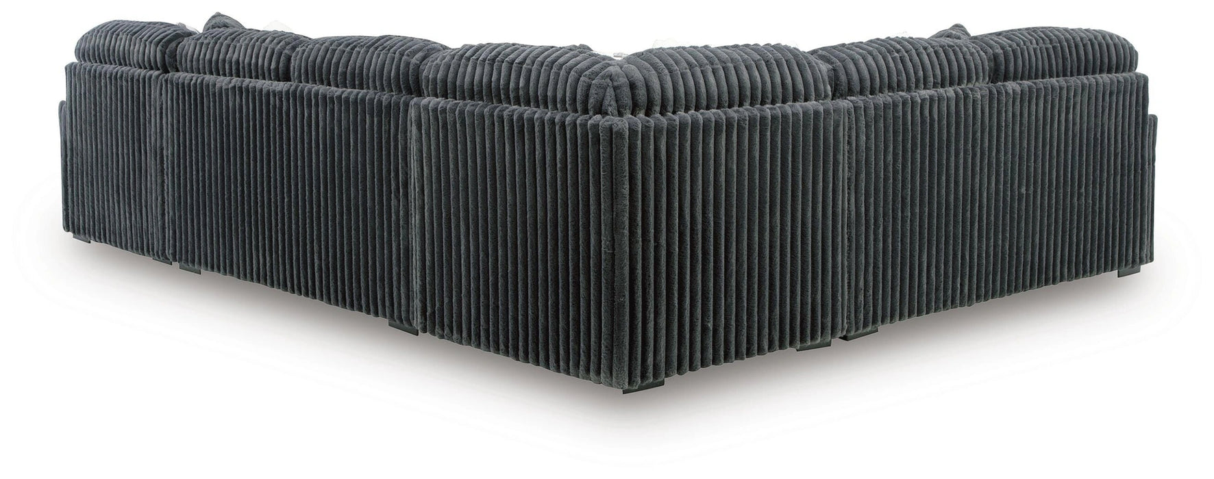 Dark gray corduroy sectional sofa, viewed from the back and side, showing the ribbed texture of the fabric on the back and base.