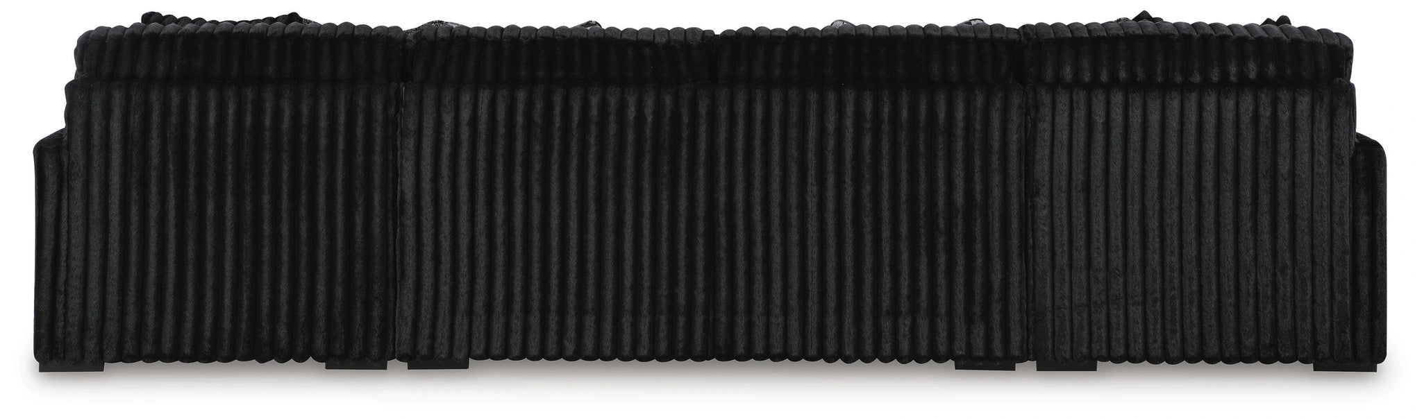 Black upholstered headboard with a plush, vertically ribbed texture and a rounded, segmented top edge.